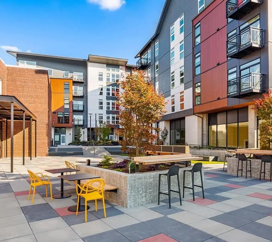 Modern apartment complex with outdoor seating